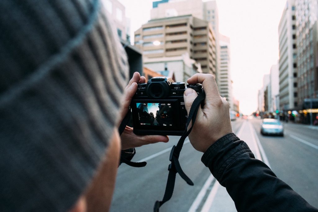 MK photo competition launched - person taking a photo of a building colour