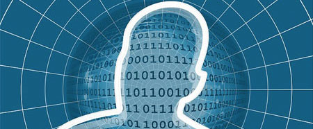 Silhouette of human head with 0's and 1's inside it on a background of a web in colour