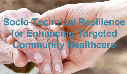 A youthful hand holding an old persons hand in colour